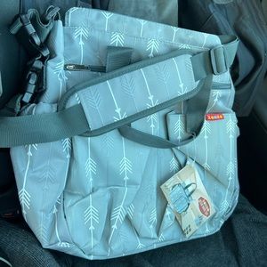 Brand new diaper bag/changing mat with tags.